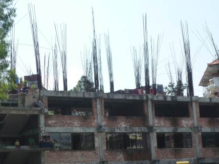 Skydivers beware. Most Nepali buildings look like this, in case the owners want to build another floor.
